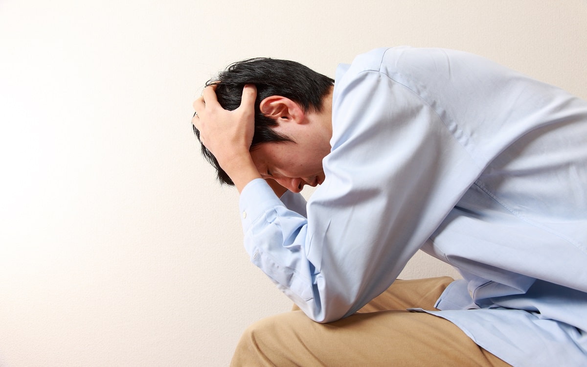 man-holding-his-head